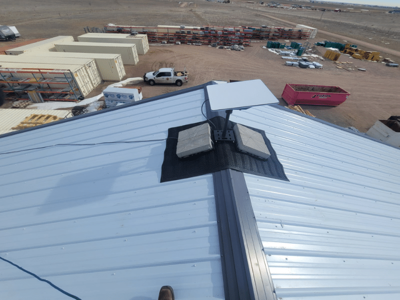 Professional Starlink dish installation on a commercial building, enabling reliable business internet service.