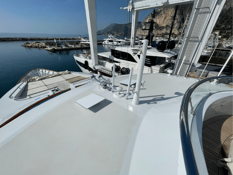Flat high-performance Starlink dish installed near the hull of a luxury yacht, ensuring elite onboard connectivity.